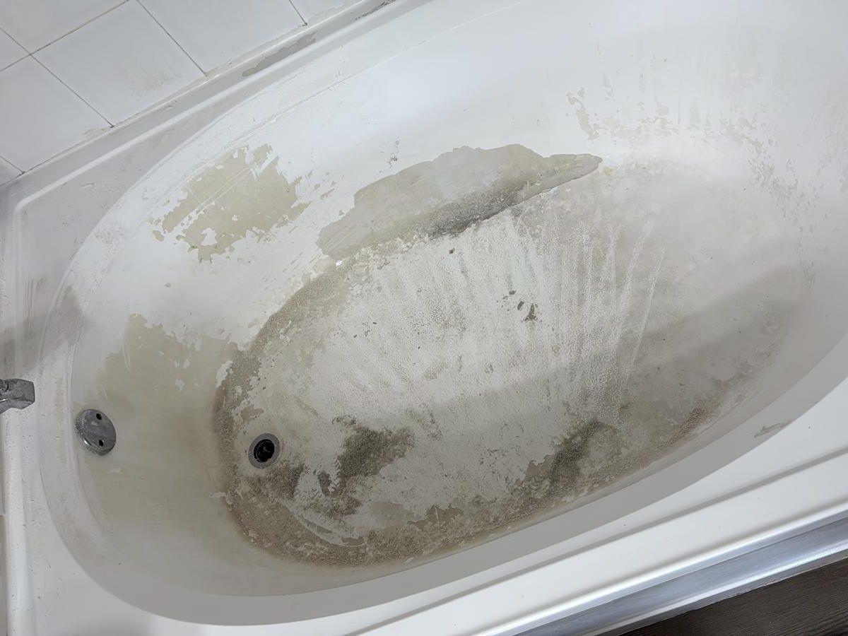 Stained and worn bathtub before reglazing
