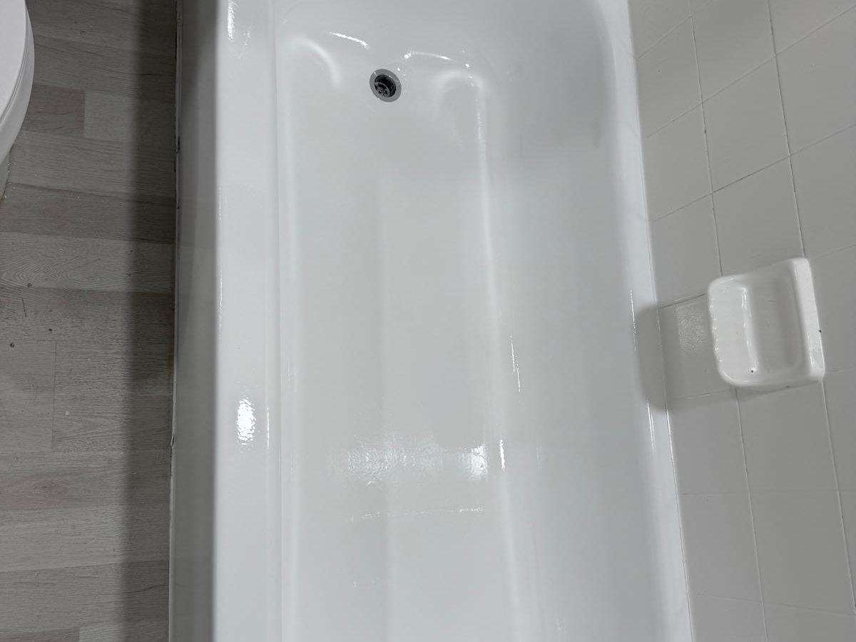 Restored bathtub with a bright white glossy finish